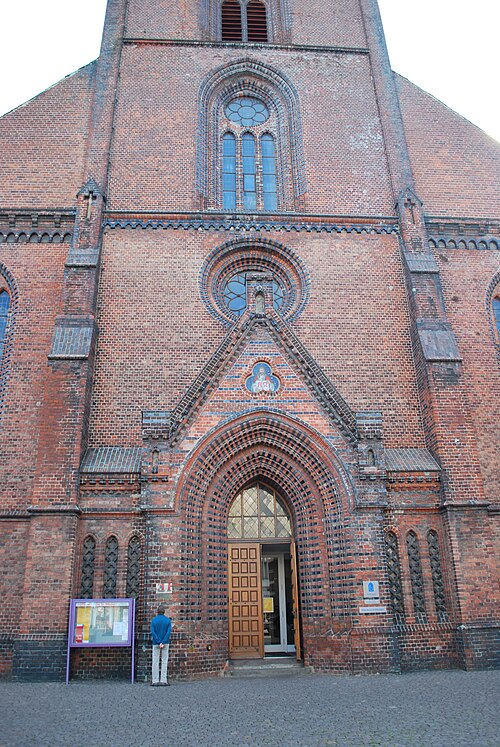 Brick facade and main entrance of St Nikolai church in Kiel
