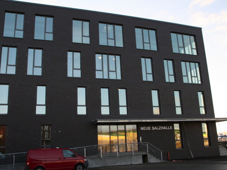 Brick facade and entrance with Neue Salzhalle lettering in Kiel